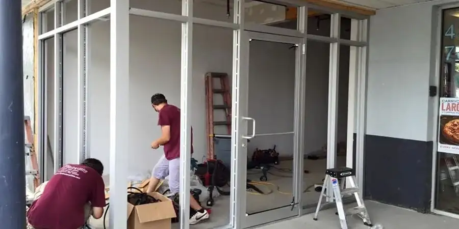 DC USA Doors crew installing a commercial aluminum storefront door